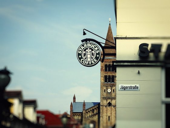 Potsdam, Germany - August 15, 2015: Starbucks is the largest coffeehouse company in the world. The company was founded in 1971 and is headquartered in Seattle, Washington.